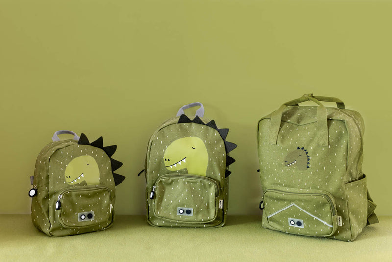 Trixie backpacks Mr. Dino